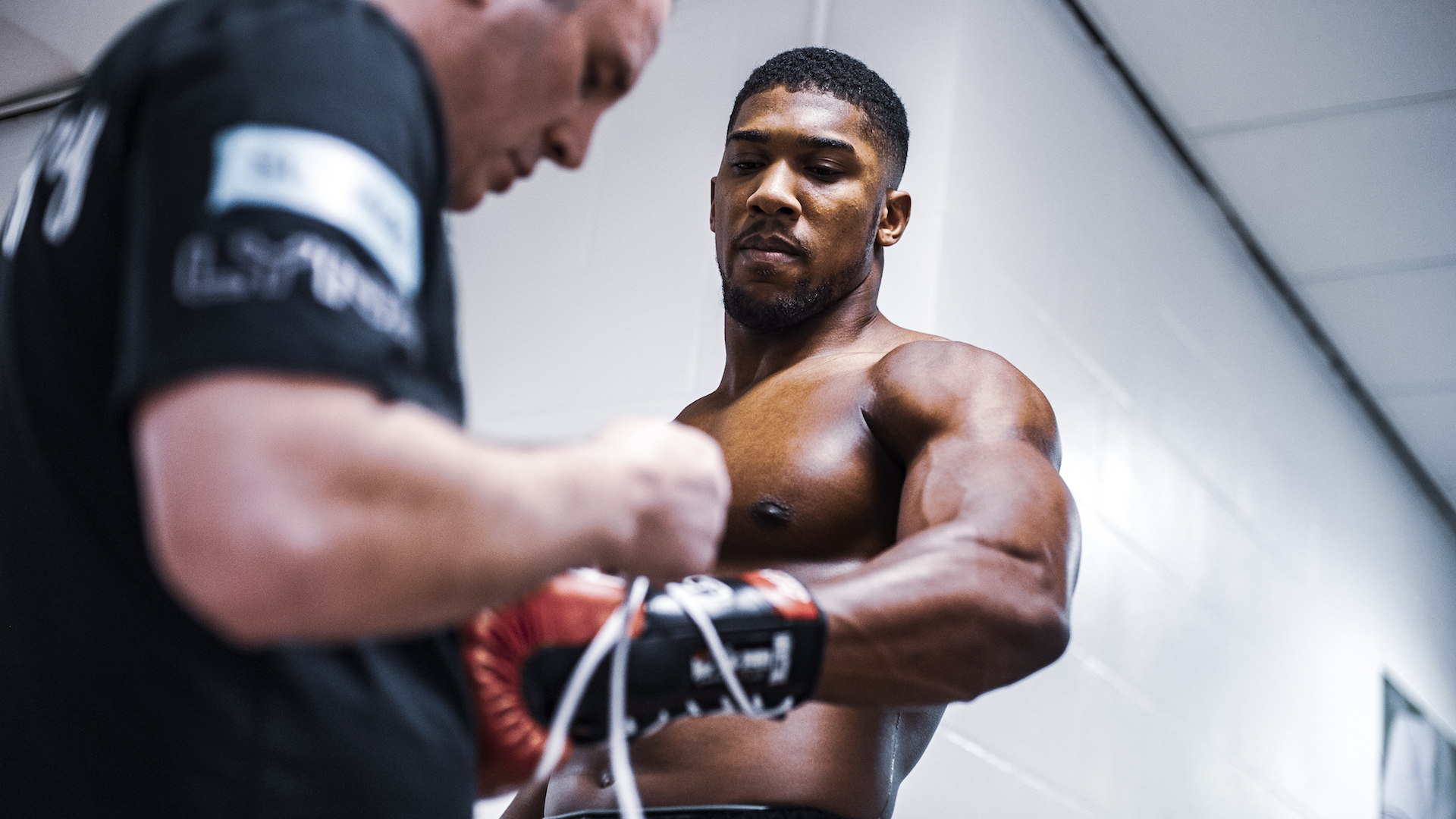 Anthony Joshua getting his glove wrap by sports photographer Stuart Manley